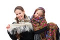 An adult mother with her daughter in russian kerchiefs