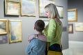 Adult mother and son exploring paintings Royalty Free Stock Photo