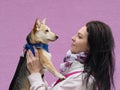 Adult nice woman walks the small dog in springtime