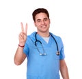 Adult nurse man with winning sign