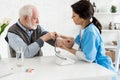 Adult nurse measuring blood pressure