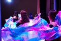 Beautiful long-haired women dancing oriental dances with scarves Royalty Free Stock Photo