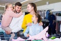 Adult parents choosing turtleneck for daughters