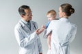 adult pediatricians with adorable little baby Royalty Free Stock Photo