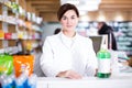 Pharmacist ready to assist in choosing at counter