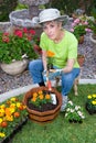 Adult planting flowers Royalty Free Stock Photo