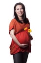 Adult pregnant woman with flowers