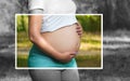 Adult pregnant woman in the park on the lawn. 9 months of pregnancy and childbirth. She holds blue shoes for the baby Royalty Free Stock Photo