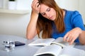 Adult pretty student girl reading a book