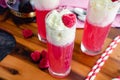 Raspberry Italian Cream Sodas Made Topped with Whipped Cream and Frozen Raspberries Royalty Free Stock Photo