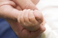 AdultÃÂ´s and babyÃÂ´s hand Royalty Free Stock Photo