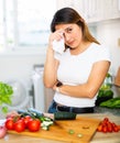 Adult sad latino woman tired of worries at kitchen Royalty Free Stock Photo