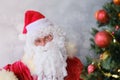 Adult santa claus with a white beard wishes a happy new year, emotionally talks about sales and discounts, the concept of