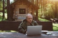 Businessman with laptop during his vacations near his summer house Royalty Free Stock Photo