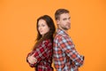 Adult siblings. Sister and brother. Confident team. Back to back standing man and woman. Fashion clothes shop. Modern Royalty Free Stock Photo