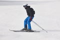 Adult skiing on a snowy hill landscape. Winter sport.