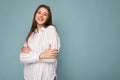 Adult smiling beautiful brunette woman with sincere emotions isolated on background wall with copy space wearing casual Royalty Free Stock Photo