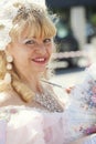 Adult smiling blond woman in Venetian costume