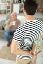 adult son giving father present Royalty Free Stock Photo