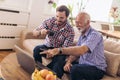Adult Son Helping Senior Father With Computer Royalty Free Stock Photo