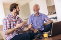 Adult Son Helping Senior Father With Computer Royalty Free Stock Photo