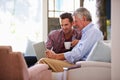 Adult Son Helping Senior Father With Computer At Home Royalty Free Stock Photo