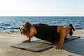 adult sportsman with wireless earphones doing push ups Royalty Free Stock Photo