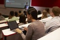 Adult student using laptop computer at a university lecture Royalty Free Stock Photo