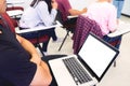 Adult students group listen to professor`s lecture and Asking Question in small class room On University Campus