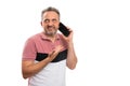Adult talking on the phone making bored uninterested expression Royalty Free Stock Photo