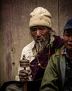 Adult Tibetan Buddhist worshiper with prayer beads at Tiji Festival in ancient Lo Manthang