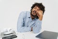 Adult tired indian man sleeping at office table