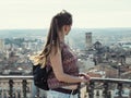 Adult tourist girl with long blonde hair looks at Tarrega city Catalonia, Spain from the observation deck. Woman close-up on the Royalty Free Stock Photo