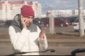 Upset young woman after a car accident calling on the phone Royalty Free Stock Photo