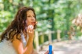 Adult woman blowing soap bubbles Royalty Free Stock Photo