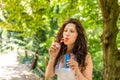 Adult woman blowing soap bubbles Royalty Free Stock Photo