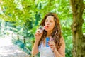 Adult woman blowing soap bubbles Royalty Free Stock Photo