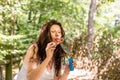 Adult woman blowing soap bubbles Royalty Free Stock Photo