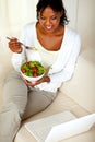 Adult woman eating healthy green salad Royalty Free Stock Photo