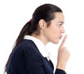 Adult woman giving the shhh. Be quit sign.