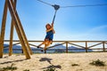 Adult woman having fun on zipline Royalty Free Stock Photo