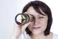 Adult woman looking into a kaleidoscope