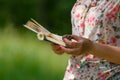 Adult woman reading the book on green meadow Royalty Free Stock Photo