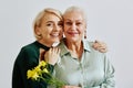 Adult Woman with Senior Mother Minimal Royalty Free Stock Photo