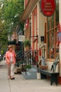 An adult woman shops in boutique stores