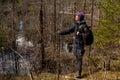 An adult woman wanders around the swamp