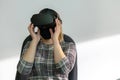 An adult woman wearing virtual reality glasses. Using VR technologies in everyday life. Introduction of augmented reality, science Royalty Free Stock Photo