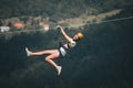 Adult woman on zip line Royalty Free Stock Photo