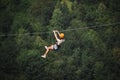 Adult woman on zip line Royalty Free Stock Photo
