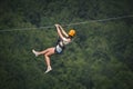 Adult woman on zip line Royalty Free Stock Photo